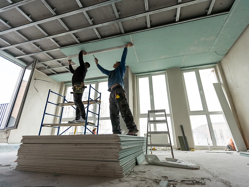 Spring Drywall Co. crew hanging drywall panels on a new build in the Spring, TX area